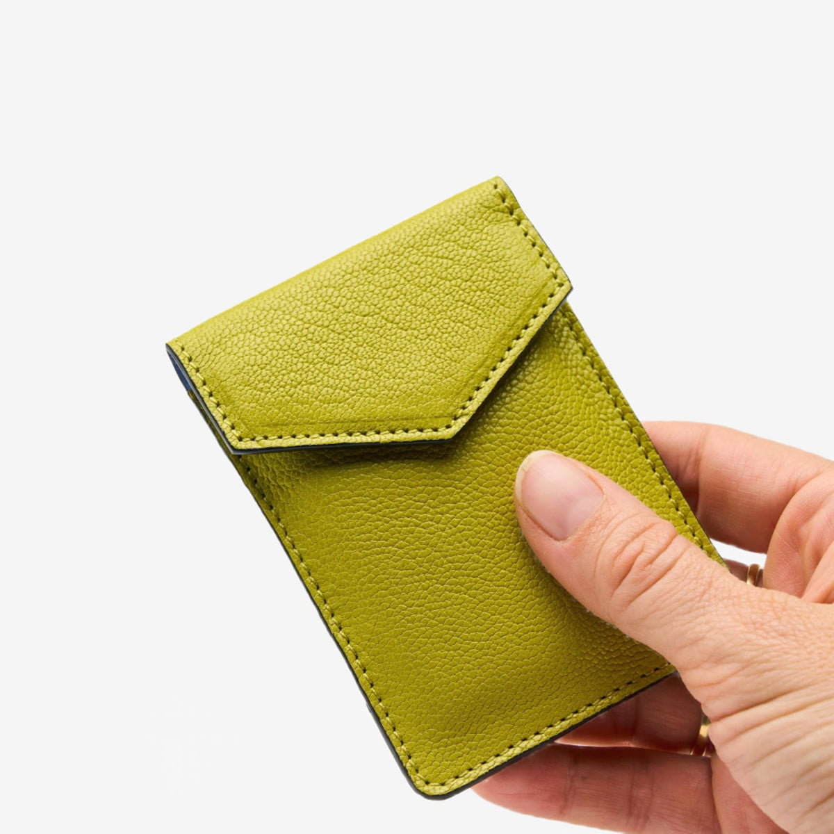 tusk-2002-mini-leather-card-case-avocado-front-hand