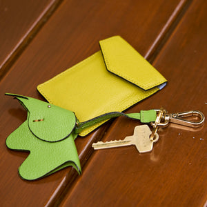 9 of 10: tusk-2002-mini-leather-card-case-lemon-still-02